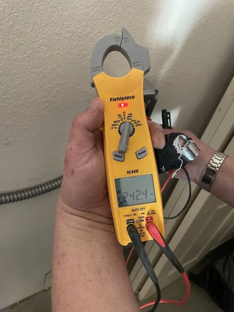 Voltage testing with clamp meter during Electrical Installation Services in Fern Park